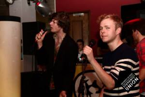 Lewis and Sam singing karaoke at the UoE SU bar.
